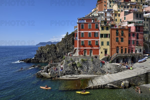 Sea kayaks in the harbour of Riomaggiore, Cinque Terre, province of La Spezia, Liguria, Italy,