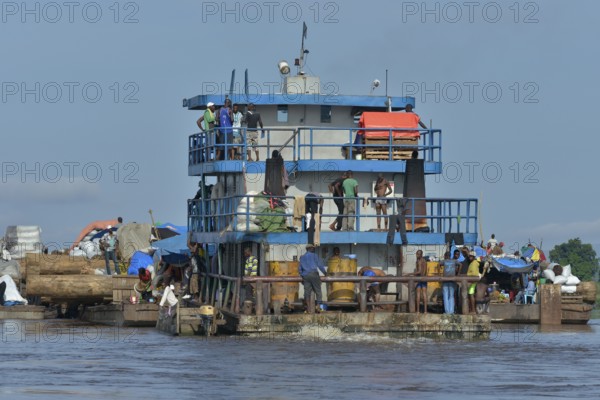 Freighter transporting logs of tropical timber on the Congo River, near Kinshasa, Kinshasa