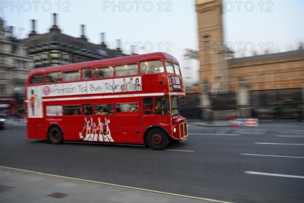 Red double-decker bus at the Houses of Parliament, Westminster, London, England, United Kingdom,