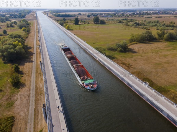 Drone shot, cargo ship on the Mittelland Canal, Magdeburg waterway junction, canal bridge,