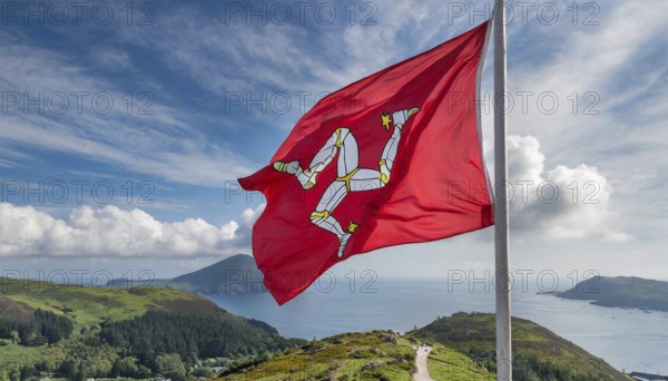The flag of the Isle of Man, Great Britain, flutters in the wind