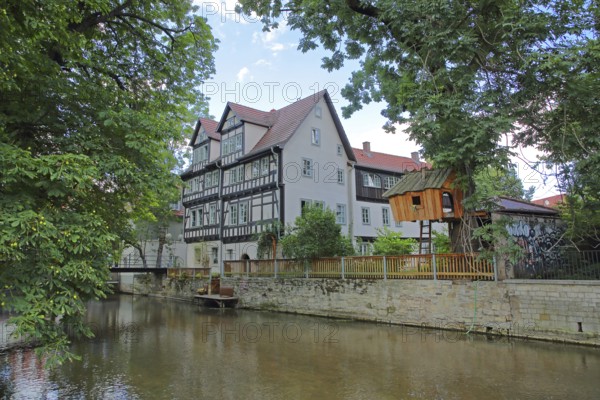 Half-timbered house and tree house on the river Gera, wooden construction, wooden house, idyll,