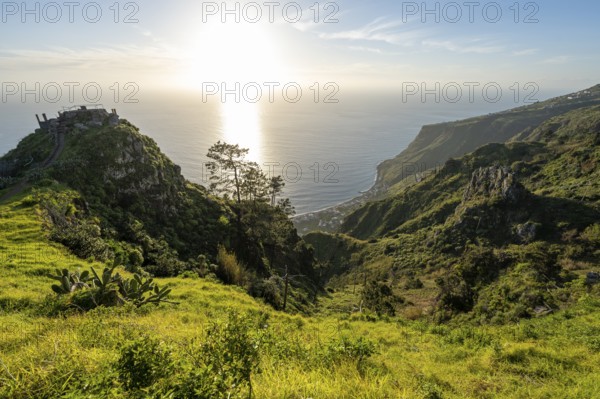 Evening mood, green coastal landscape on a steep cliff, sea and coast, viewpoint Miradouro da