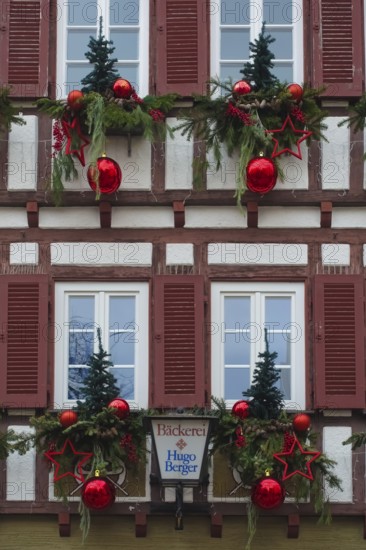 House facade with Christmas decoration, window, window shutters, half-timbered, Christmas motif,