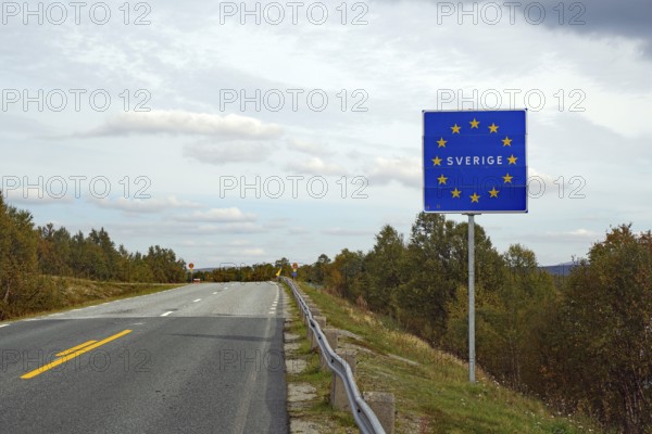 European sign on a road, showing the border to Sweden under a cloudy sky, Jämtland, Sweden, Europe