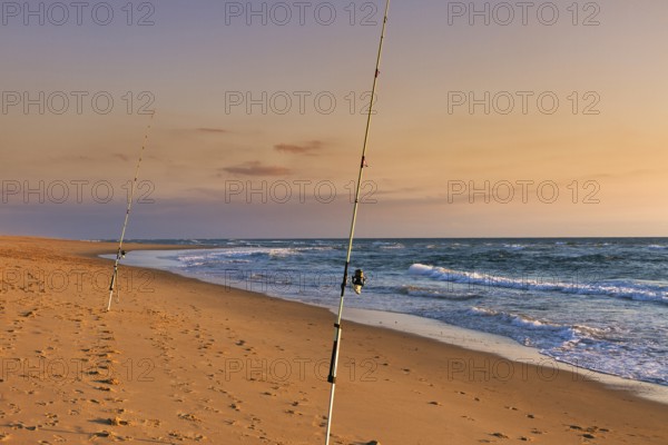 Surf fishing, two rods standing on the beach, Soustons Plage, evening light, Silver Coast, Côte