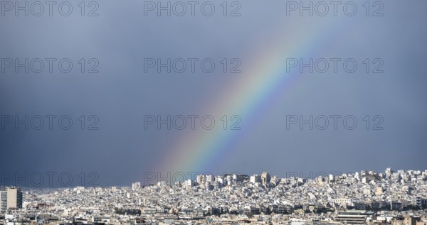 View over the sea of houses of Athens, with rainbow, Athens, Attica, Greece, Europe