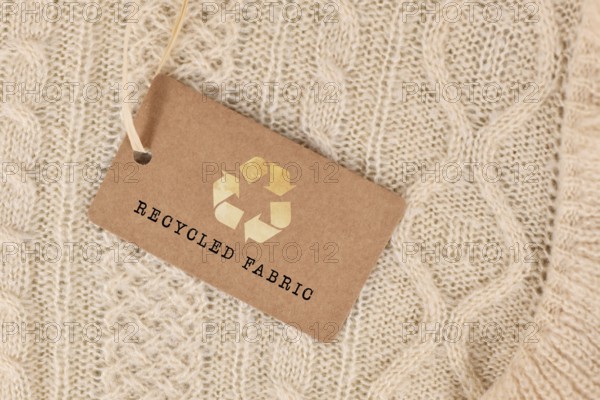 Knitted fabric with label saying 'recycled fabric'