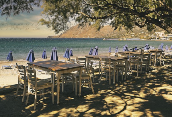 Gastronomy, tables and chairs on the beach, Plakias, Crete, Greece, Europe