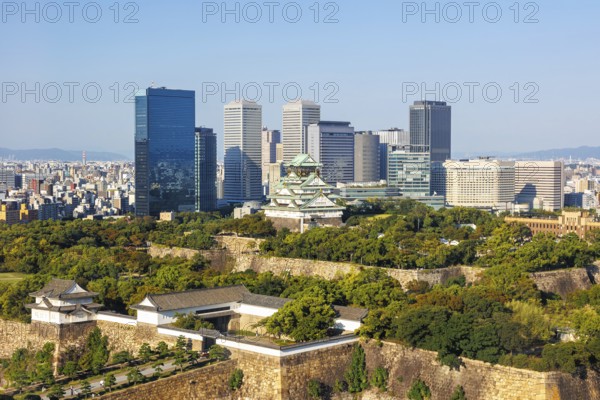 Osaka Castle from above with the skyline skyscrapers in Osaka, Japan, Asia