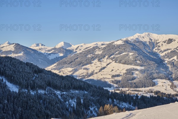 View on to the mountains from Wildpark Aurach in winter, snow, Kitzbuehl, Tirol, Austria, Europe