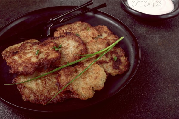 Potato pancakes, pancakes with sour cream, Belarusian dish, homemade, no people