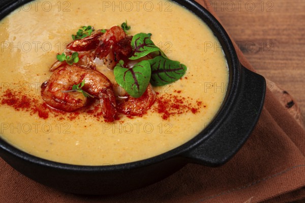 Pumpkin cream soup with shrimp, herbs and spices, homemade, no people