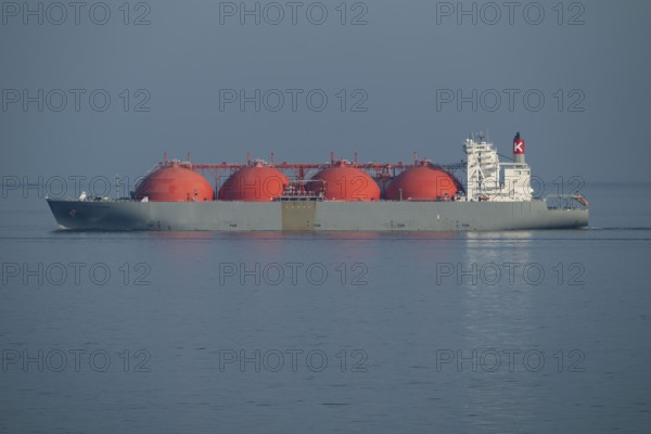 Liquefied natural gas is transported by LNG tanker Arctic Voyager, 290 metres long, 48 metres high,