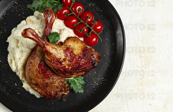 Fried duck shank, cauliflower puree, cherry tomatoes, homemade, no people