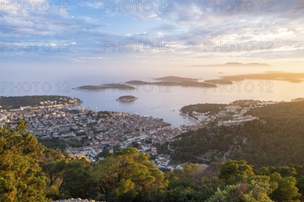 View of the old town centre of Hvar at sunset, behind Pakleni or Paklinski Islands, Dalmatia,