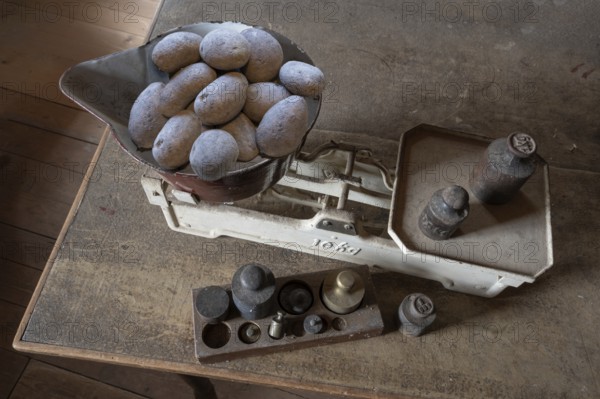 Old scales with weights in a former corn mill, Bavaria, Germany, Europe