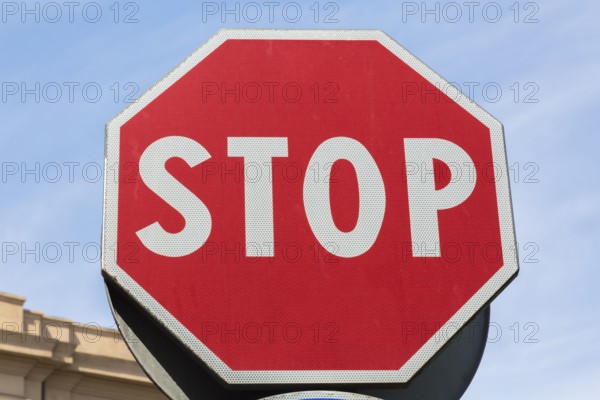 Close-up of red and white traffic stop sign made of reflective material, Messina, Sicily, Italy,