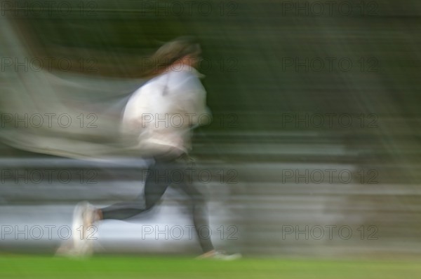 Jogger, long exposure, wipe image, Stuttgart, Baden-Württemberg, Germany, Europe