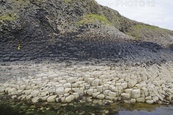Detailed view of striking basalt formations on a coastline. Hebridean Overture, Staffa Island,