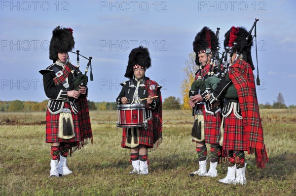 Scottish bagpipers playing pipes and drums, Scotland, UK