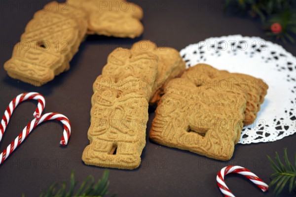 Speculaas or speculoos, a spiced thin, crunchy and caramelizedand shortcrust biscuit with figure