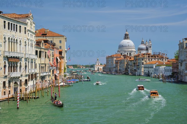 VENICE, ITALY, JULY 19, 2019: View of Venice Grand Canal with boats and Santa Maria della Salute