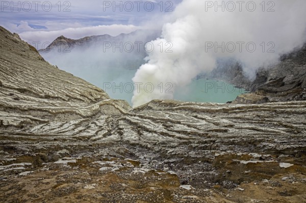 Sulfuric lake of Kawah Ijen Mountain's cauldron in the Banyuwangi Regency of East Java, Indonesia,