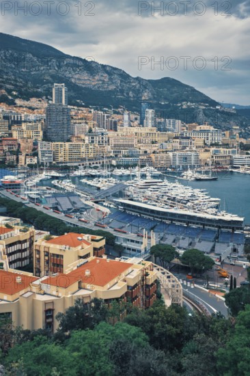 View of Monte Carlo, Monaco with race track street circuit and port with yachts and boats