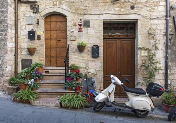 Vespa scooter in the streets of Assisi Old Town, Umbria, Italy, Europe