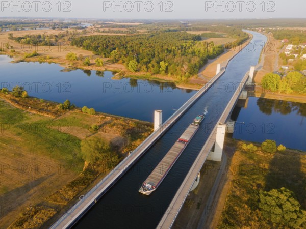 Drone shot, cargo ship on the Mittelland Canal, Magdeburg waterway junction, canal bridge,