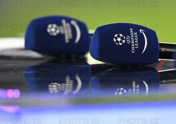 Microphones Logo Champions League CL lie on presenter's table, Allianz Arena, Munich, Bavaria,