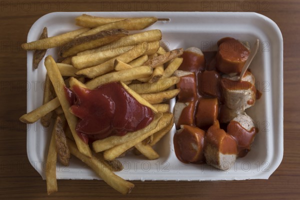 Currywurst with fries as take away, Bavaria, Germany, Europe