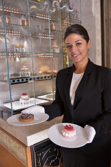 Waitress serving pastry at the Royal Mansour Hotel, Marrakesh, Marrakesh-Tensift-El Haouz region,