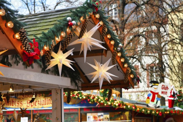 Heidelberg, Germany, November 2019: Seasonal decoration with fir branches, baubles and big paper