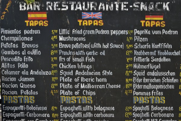 Menu with tapas and pastas on offer in front of a restaurant, Puerto de Sóller, Majorca, Balearic