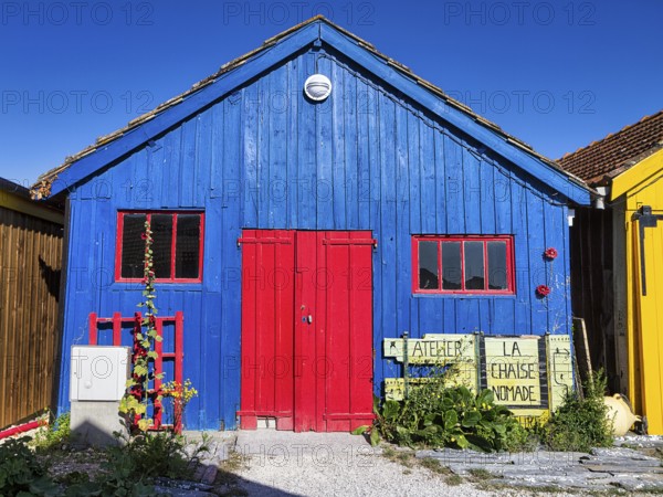 Colourful cottage, blue wooden façade, red door and windows, studio, Le Château-d'Oléron, Oleron