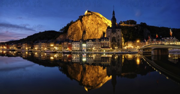 Night panorama of Dinant town, Collegiate Church of Notre Dame de Dinant over River Meuse and Pont