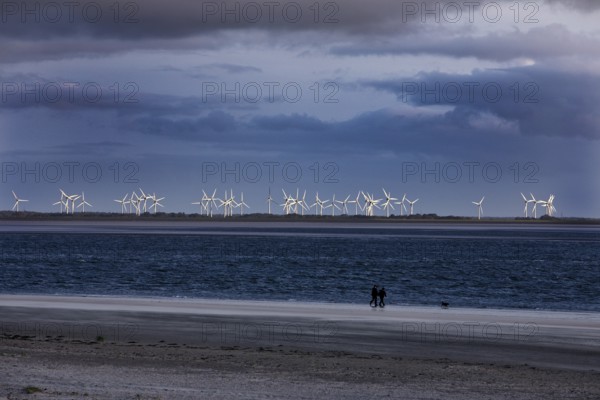 From the beach in Norderney many wind turbines can be seen in Norddeich, East Frisia, Lower Saxony,