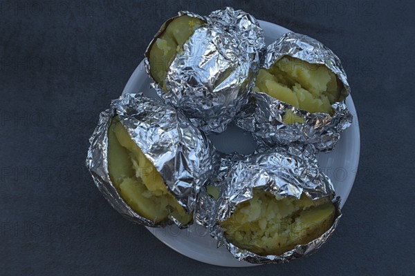 Jacket potatoes wrapped in aluminium foil, Bavaria, Germany, Europe