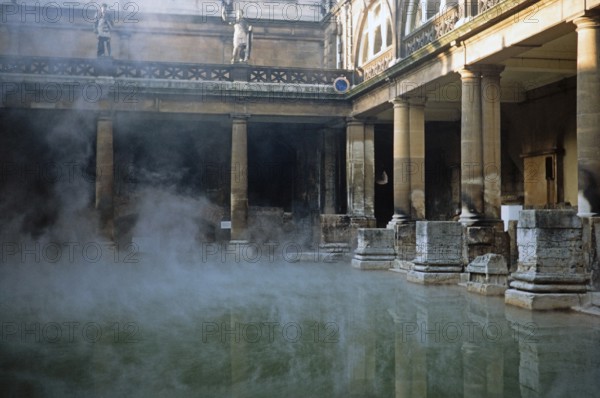 Steam rising from the hot waters of the Great Bath, Roman Baths, Bath, North East Somerset,