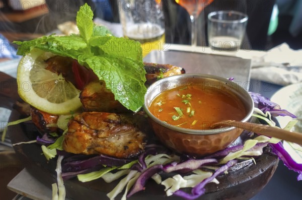 Indian cuisine, Indian duck with red cabbage, sauce, lemon slice, roasted, savoury, salty,