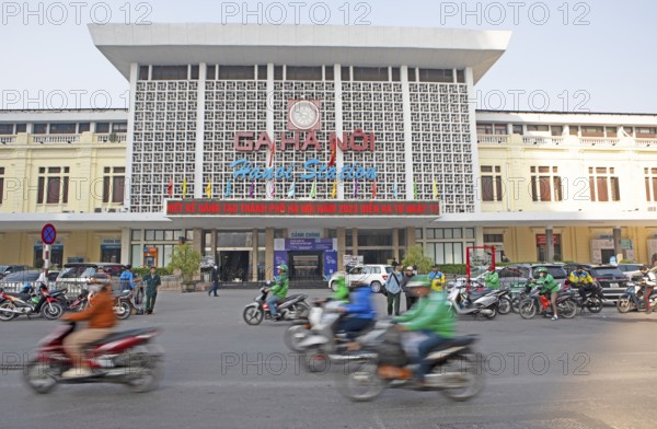 Moped rider at Hanoi railway station, Vietnam, Asia