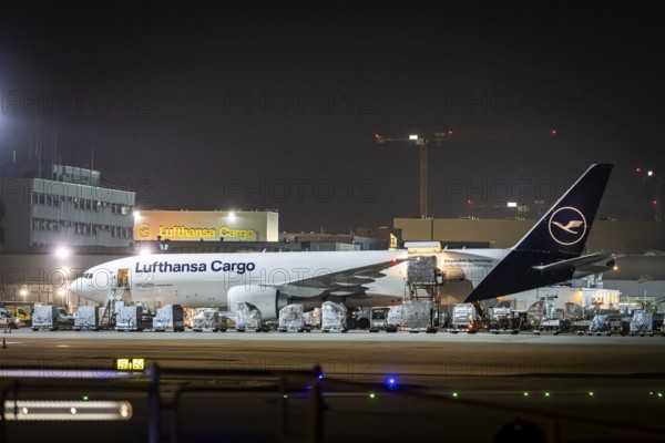 Lufthansa Cargo aircraft being loaded at the cargo centre, early in the morning at the airport in