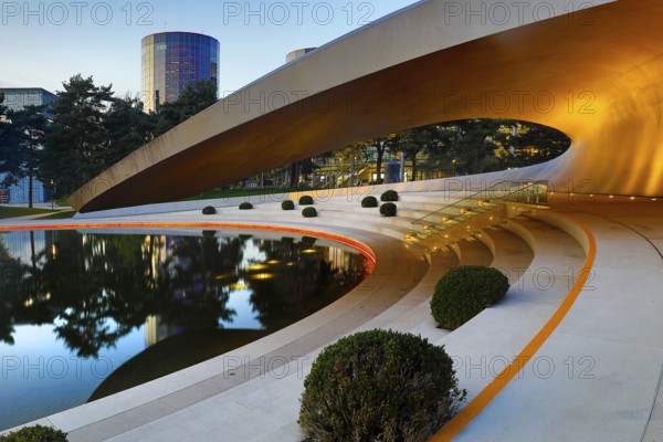 Illuminated Porsche Pavilion in the evening, Autostadt, Volkswagen AG, Wolfsburg, Lower Saxony,