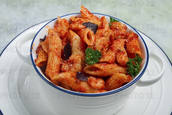 Penne pasta, with shrimp in tomato sauce, close-up, no people