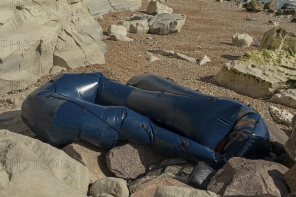 Damaged dinghy on the beach, Samphire Hoe country park, Kent, England, United Kingdom, Europe
