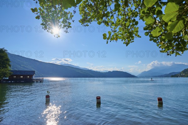 Lake, boathouse, sun, standup paddler, evening, summer, Lake Millstatt, Döbriach, Carinthia,