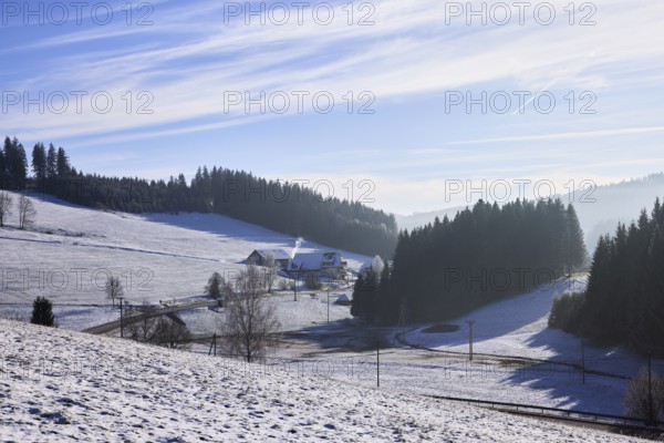 Winter landscape with hills and haze, snow, road, farmstead, Titisee-Neustadt, Black Forest,