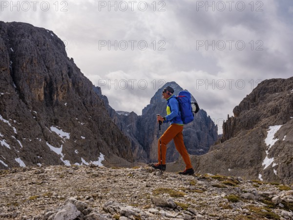 Mountaineers in the Molignon Pass on the Dolomite High Route number 8, Catinaccio, Dolomites, South